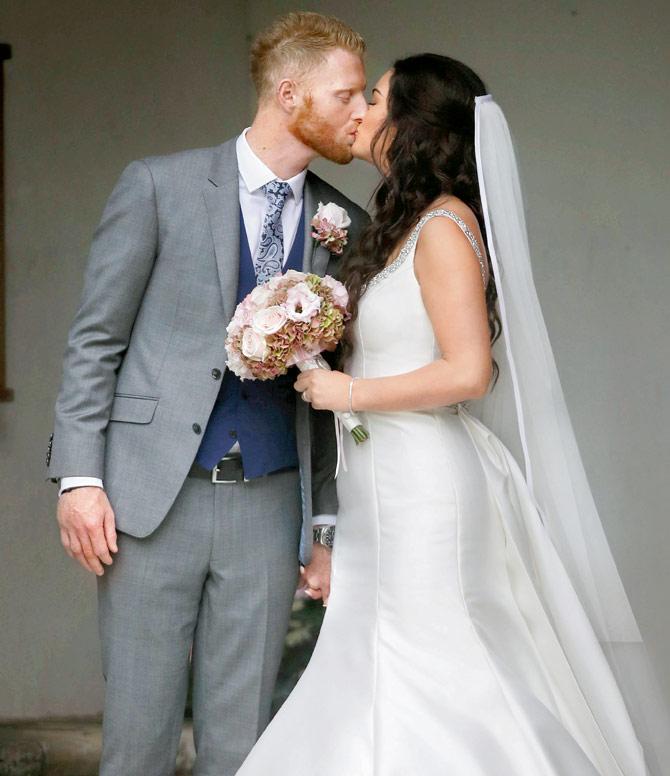 Ben Stokes kisses wife Clare, outside St Mary the Virgin church, Somerset on Saturday. Pic/Getty Images