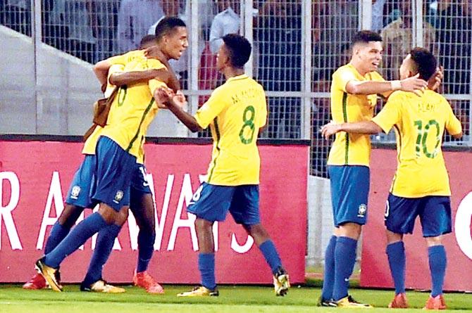 The Brazilian are a jubilant bunch after scoring against Germany in the FIFA U-17 World Cup quarter-final at Kolkata yesterday. Pic/PTI