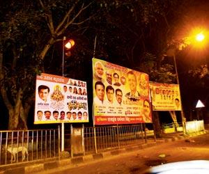 BJP, Congress woo north Indians with illegal hoardings in Juhu
