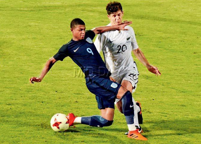 England forward Rhian Brewster (left) tackles New Zealand defender Emlyn Wellsmore during a FIFA under-17 World Cup warm-up tie at the Mumbai Sports Arena, Andheri yesterday. Pic/Suresh Karkera