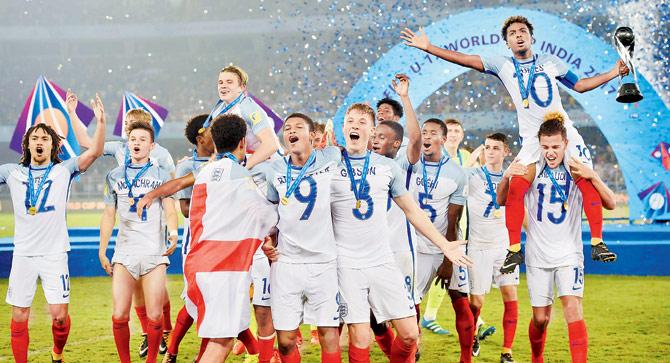 England players celebrate after winning the FIFA U-17 World Cup final with a 5-2 win over Spain at Kolkata on Saturday. Pic/PTI