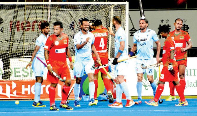Jubilant Team India players (in blue) celebrate a goal against Bangladesh in an Asia Cup match at Dhaka yesterday
