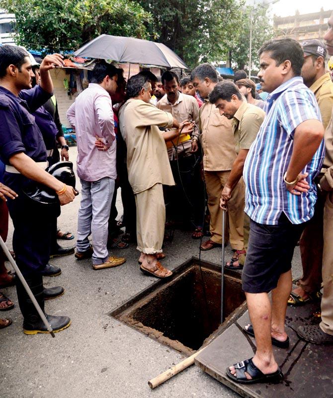 The open manhole in which Dr Deepak Amarapurkar fell into and drowned during the deluge in August