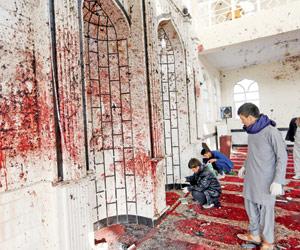 Dozens killed as triple suicide bombings hit Afghanistan