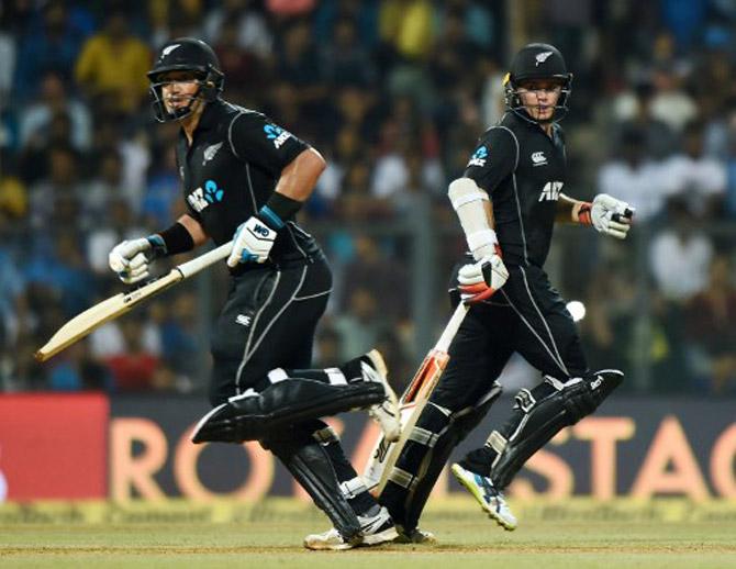 New Zealand batsmans Tom Latham (R) and Ross Taylor run between the wickets during the first one-day international cricket match between India and New Zealand at the Wankhede stadium in Mumbai on October 22, 2017. 