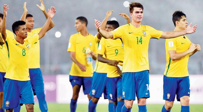 Brazil players acknowledge the crowd after their win over Mali on Saturday