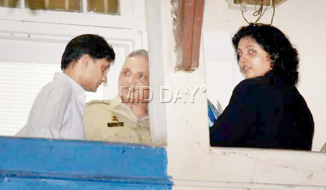 Rishi Shah (in white) and ACP Sanjay Kadam at Bandra police station on Tuesday. Pic/Pradeep Dhivar