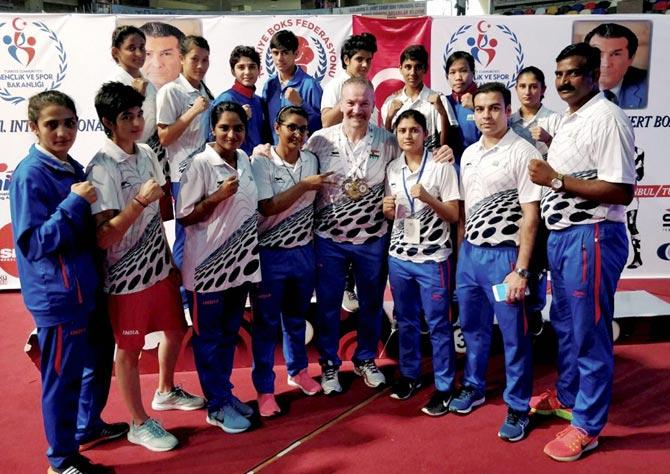 India’s women pugilists pose for picture with the coach and support staff at the Ahmet Comert International Boxing Championship in Istanbul on Sunday. The pugilists returned with 9 medals, including a gold medal. Pic/PTI