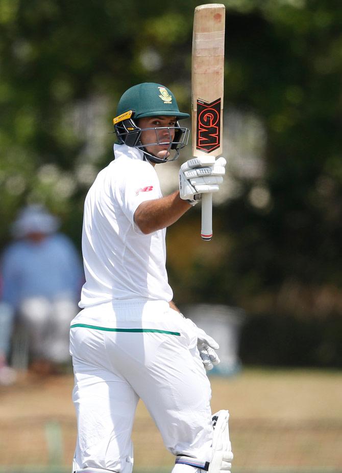 South African batsman Aiden Markram raises his bat as he celebrates scoring half century (50 Runs) during the first day of the first Test Match between South Africa and Bangladesh on September 28, 2017 in Potchefstroom, South Africa. Pic/AFP