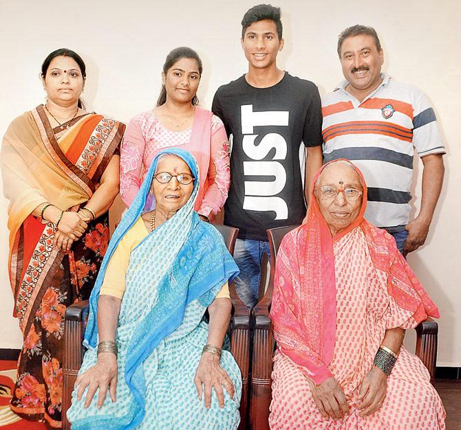Aniket with father Anil (right), mother Kartiki and sister Kajal
