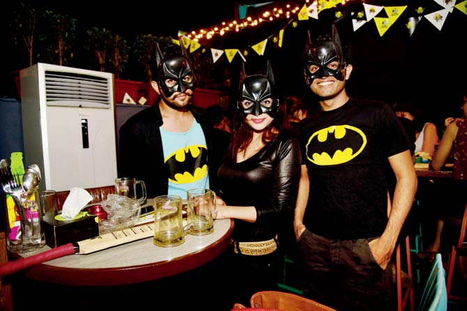 Batman cosplayers at an event in the city
