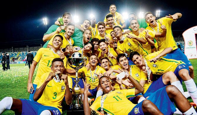 Brazil players pose with the South American U-17 trophy at Chile in March this year. pic/Getty Images