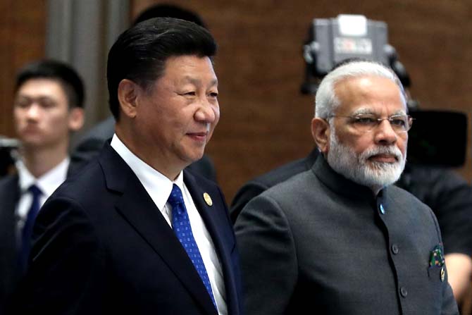 Chinese President Xi Jinping and Indian Prime Minister Narendra Modi attend the Dialogue of Emerging Market and Developing Countries on the sidelines of the 2017 BRICS Summit in Xiamen, southeastern China