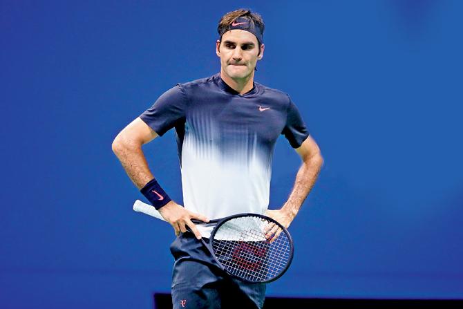 Roger Federer reacts after losing to Juan Martin del Potro during their US Open quarter-final in New York on Wednesday. Pic/AFP