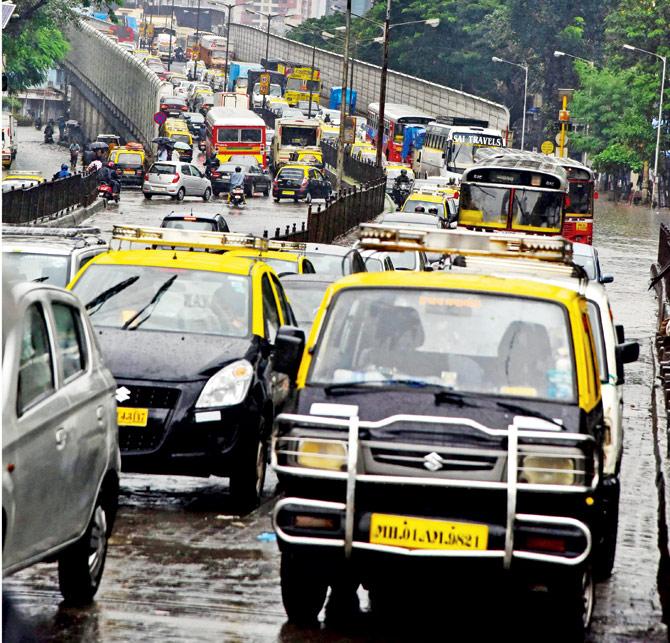 A file photograph of a traffic snarl across water-logged Parel and Hindmata flyovers. Pic-Atul Kamble