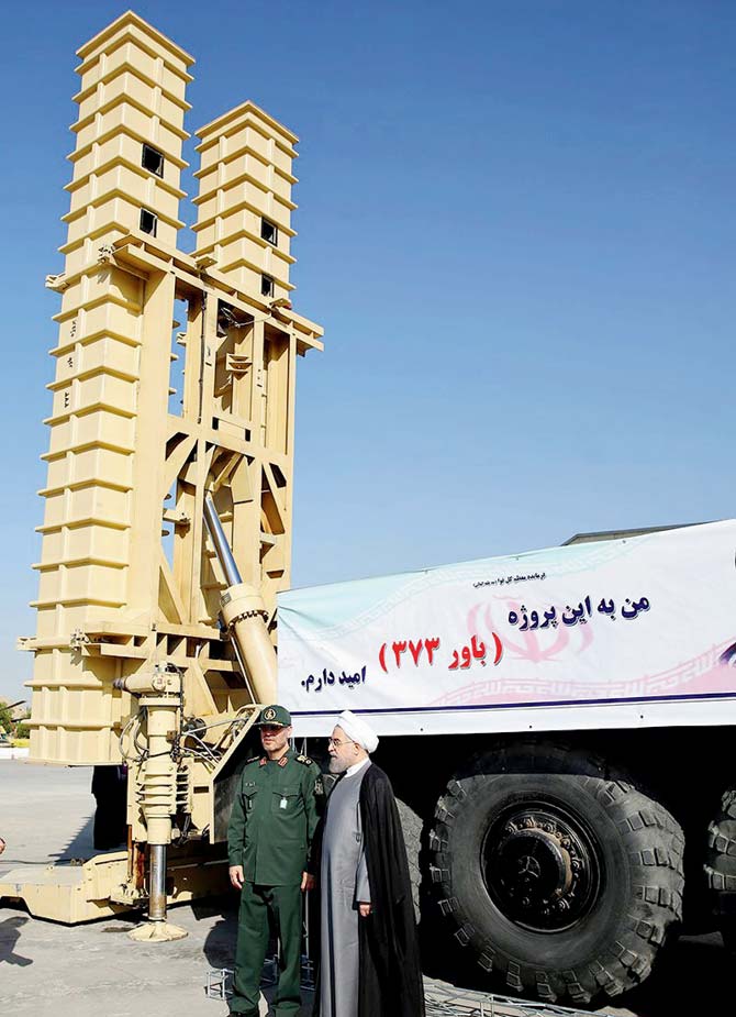 Iranian President Hassan Rouhani and Iranian Defence Minister Hossein Dehghan standing next to the new Bavar 373 missile defence system in 2016. Pic/AFP