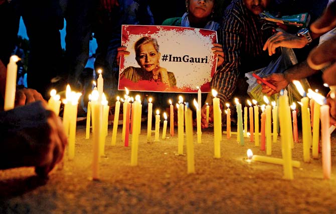 Activists take part in a protest rally against the killing of Gauri Lankesh at India Gate in Delhi. Pics/AFP