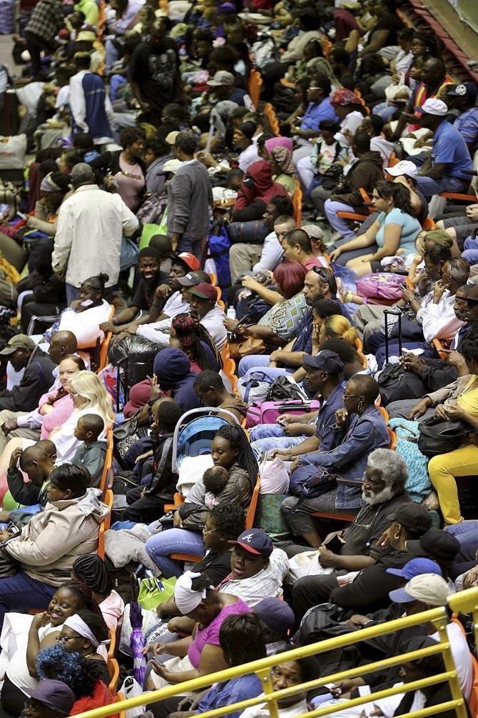 Hundreds of local residents being evacuated from the city fill the Savannah Civic Center during a mandatory evacuation from Hurricane Irma on Saturday, Sept. 9, 2017, in Savannah, Ga. Irma regained Category 5 status late Friday. Thousands of people in the Caribbean fought desperately to find shelter or escape their storm-blasted islands, and more than 6 million people in Florida and Georgia were warned to leave their homes. Pic/AP/PTI
