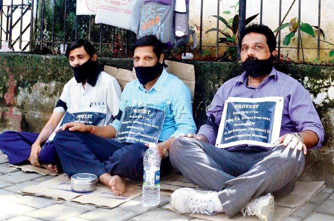 The protesting staff Jayesh Parmar (left), Dattatray Tambadkar and Anthony D