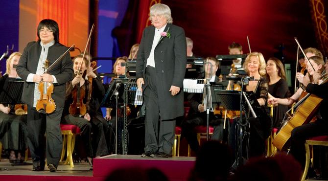 Sir Karl Jenkins (centre) with violin virtuoso Marat Bisengaliev at a concert. The two will perform together again. Pic/getty images