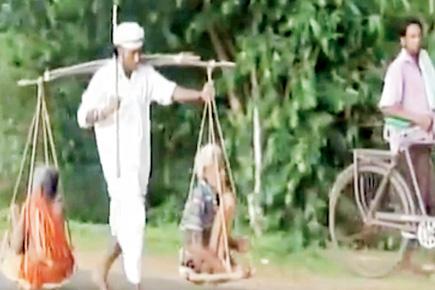 Tribal man carries parents on shoulders for 40 km for justice