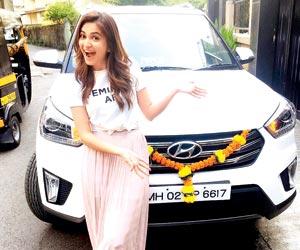 Kriti Kharbanda gifts parents and herself swanky new car