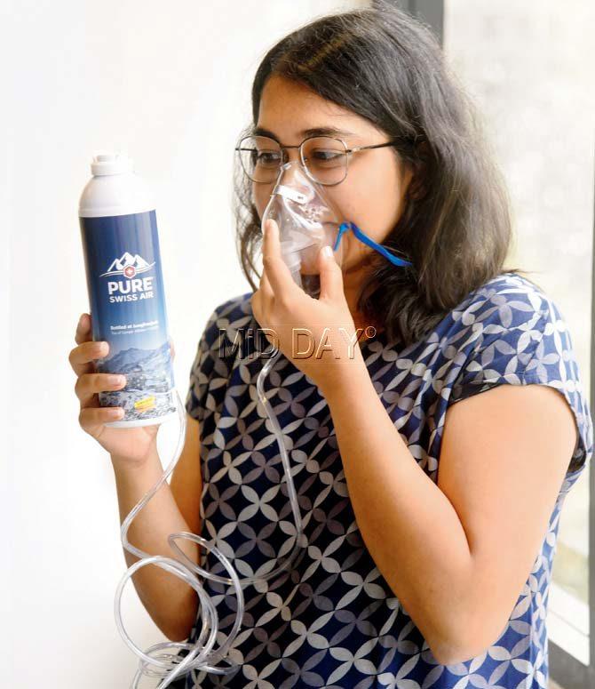 The writer inhales the air using an oxygen mask. Pic/Nimesh Dave