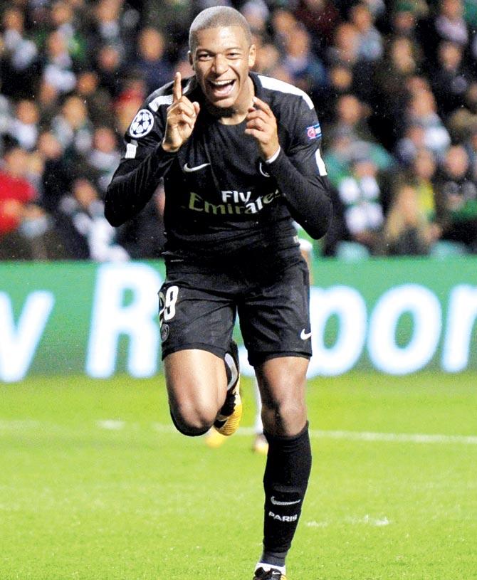 PSG striker Kylian Mbappe celebrates after scoring his team