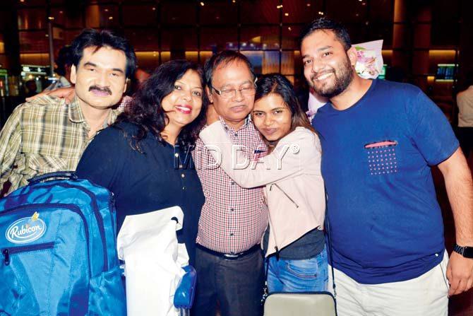 Captain Lal Bihari Singh, 60, (centre) had an emotional reunion with his family last night