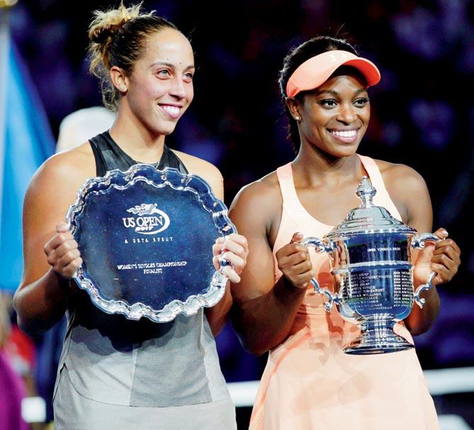 Madison Keys (left) and Sloane Stephens pose with their trophies after the US Open women