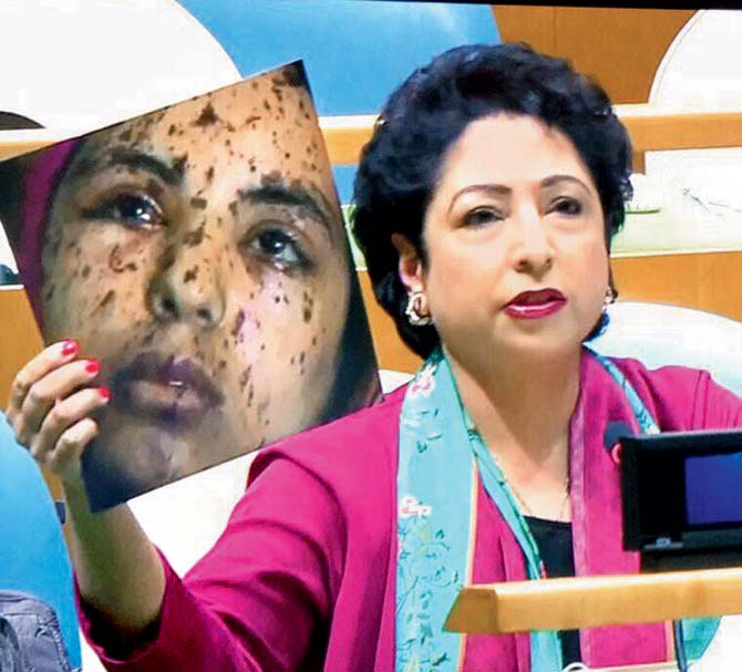 Maleeha Lodhi shows the photo that portrays an injured Gaza girl as a Kashmiri pellet gun victim