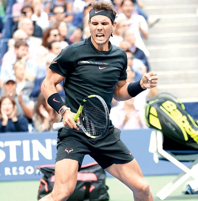 Rafael Nadal reacts after winning a point against Kevin Anderson during the US Open men