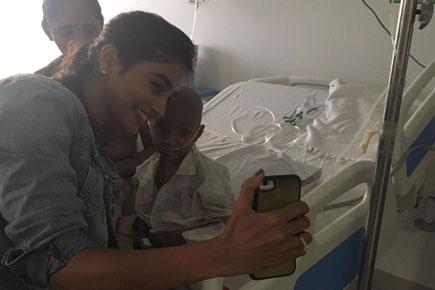 Pooja Hegde meets cancer-affected children, brings smiles on their faces