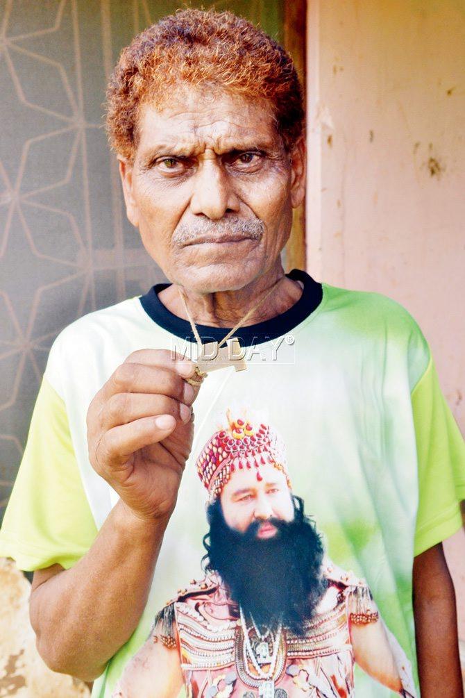 Ramnath Insan is one of the 60 million Ram Rahim  followers, who has been given a locket with a registration number. This helps the Dera sect maintain a record of its followers.  Pic/Datta Kumbhar