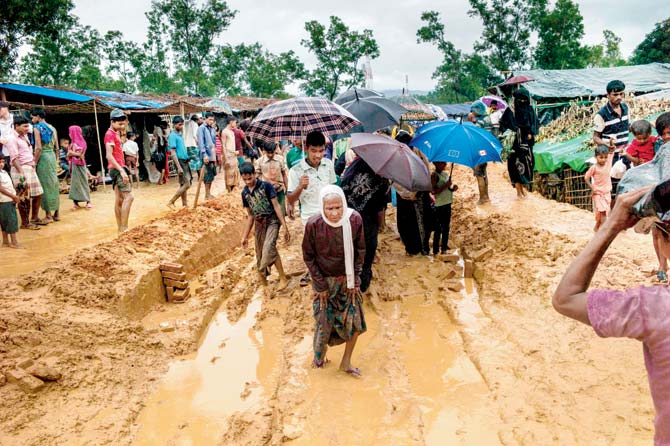 Rohingya Muslim refugees walk through Kutupalong refugee camp in the Bangaldeshi district of Ukhia on Thursday. Pic/AFP