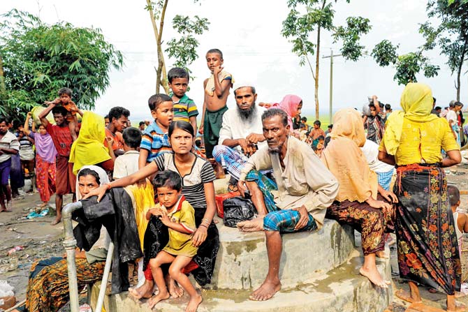 Rohingya refugees from Myanmar’s Rakhine state at the Khanchon border crossing near Bangladeshi town of Teknaf. Pics/AFP