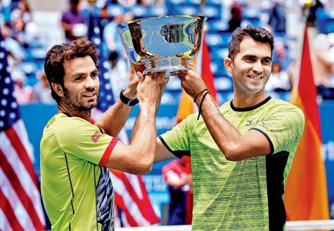Jean-Julien Rojer (left) and Horia Tecau pose with the US Open men