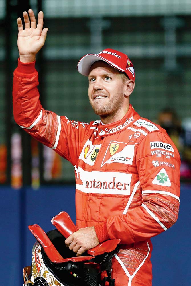 Sebastian Vettel after claiming pole position in Singapore on Saturday. Pic/Getty Images