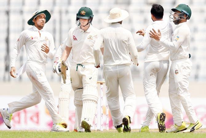Bangladesh Shakib Al Hasan second from right celebrates Australian skipper Steve Smith’s wicket during first Test at the Shere Bangla National Stadium in Mirpur last Wednesday. Pic/Getty Images