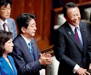 Japanese Prime Minister Shinzo Abe calls for snap poll, faces Koike challenge
