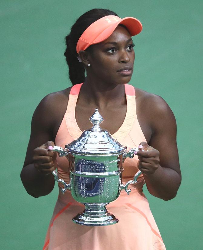 Sloane Stephens of the United States poses with the championship trophy during the trophy presentation after the Women