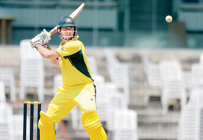 Australian Marcus Stoinis plays a shot during the warm-up match against Board President