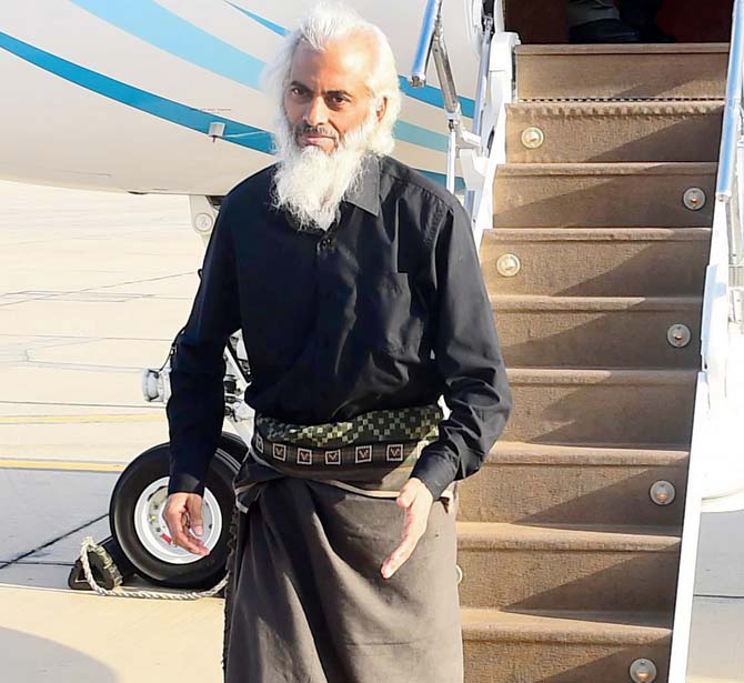 Thomas Uzhunnalil disembarks from a Royal Air Force of Oman plane in Muscat. Pic/AFP