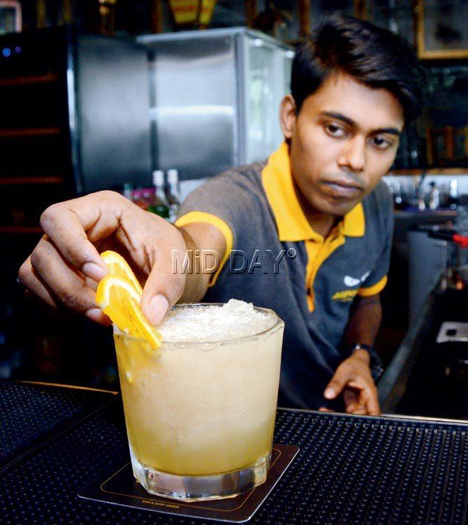 A bartender making Jacks Whiskey Sour at Agent Jack, Andheri. Pic/Satej Shinde
