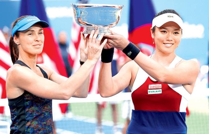 Martina Hingis (left) and Yung-Jan Chan of Taiwan with the US Open women