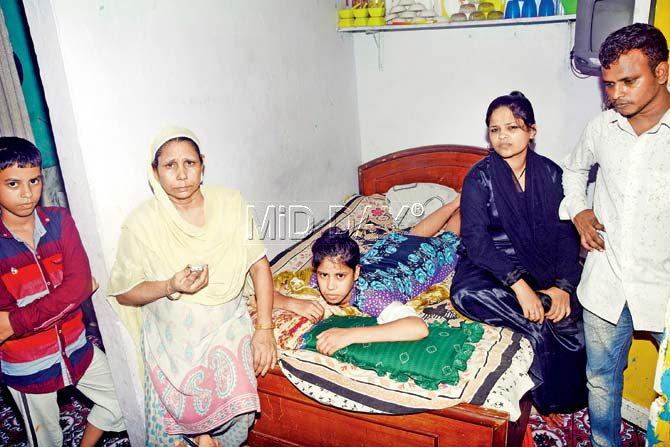 Anjum, who is unable to lie on her back is living with her mother, brother and her sister-in-law (right). Pic/ Sameer Abedi