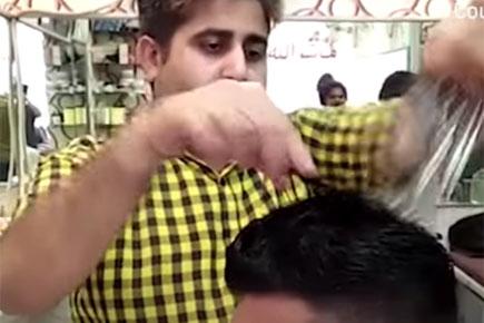 Watch video: Pakistan barber uses 15 scissors at once to give a haircut