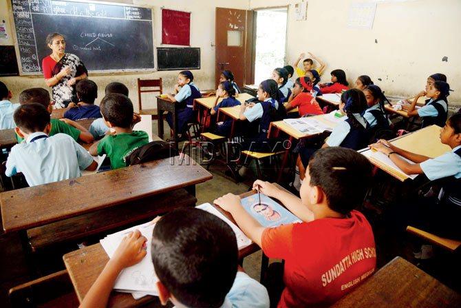 Sujata Kate, principal of Sundatta High School, a Marathi-cum-English medium school at Tardeo, holds a class on child sexual abuse for students. Pic/Suresh Karkera
