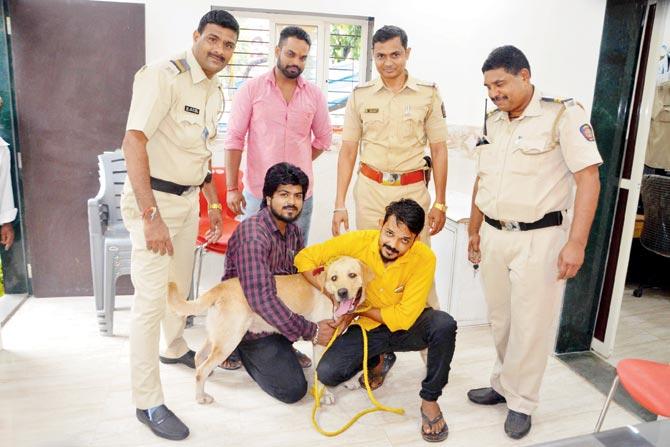 Bruno with his owner and the cops who rescued him. Pic/ Rajesh Gupta  Bruno with his owner and the cops who rescued him. Pic/ Rajesh Gupta  