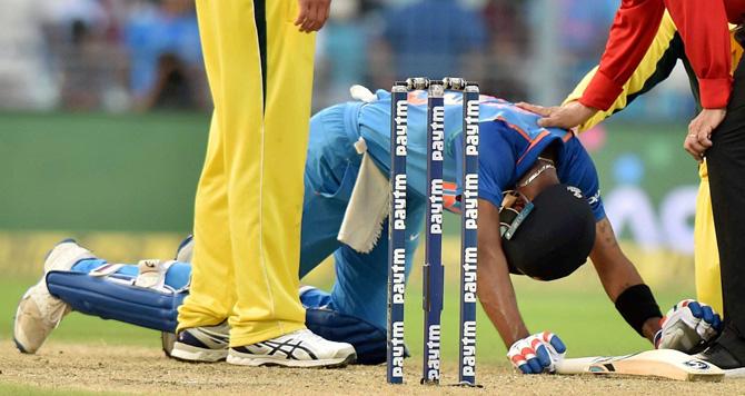 Indian batsman Hardik Pandya slips on the pitch during the 2nd ODI cricket match against Australia at Eden Garden in Kolkata on Thursday. Pic/PTI